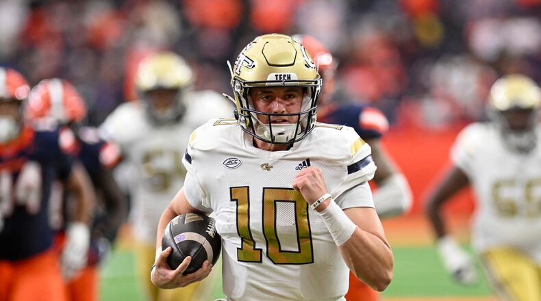 Georgia Tech quarterback Haynes King (10) runs for a touchdown during the first half of an NCAA football game against Syracuse, Saturday, Sept. 7, 2024 in Syracuse, N.Y. (AP Photo/Hans Pennink)