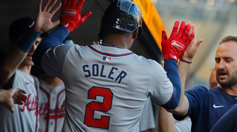 Atlanta Braves' Jorge Soler celebrates his solo home run against the Minnesota Twins in the first inning of a baseball game Wednesday, Aug. 28, 2024, in Minneapolis. (AP Photo/Bruce Kluckhohn)