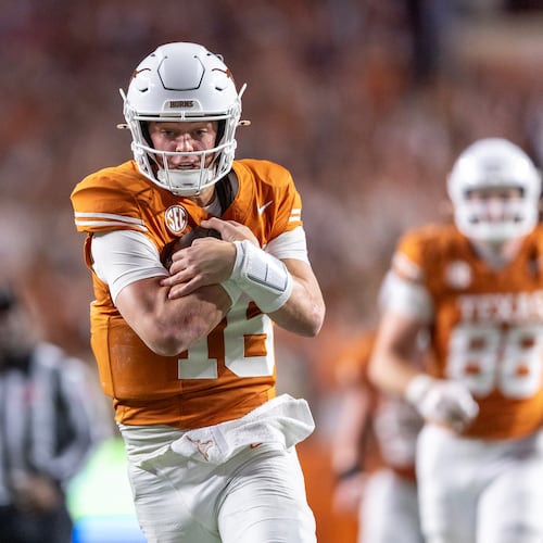 FILE - Texas quarterback Arch Manning (16) scores a touchdown past Texas A&M cornerback Will Lee III (4) during the second half of an NCAA college football game Friday, Nov. 28, 2025, in Austin, Texas. (AP Photo/Stephen Spillman, File)