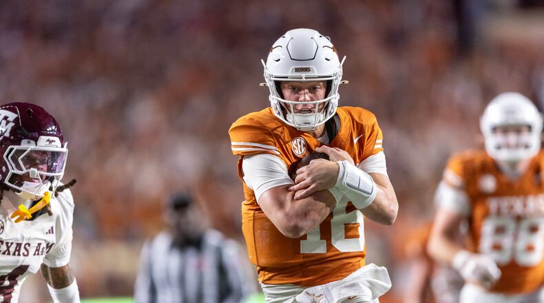 FILE - Texas quarterback Arch Manning (16) scores a touchdown past Texas A&M cornerback Will Lee III (4) during the second half of an NCAA college football game Friday, Nov. 28, 2025, in Austin, Texas. (AP Photo/Stephen Spillman, File)