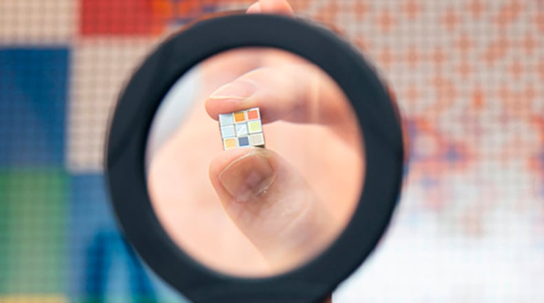 In this photo provided by Maciej Komorowski of Hungary Embassy, the world's smallest Rubik's Cube is shown in Tokyo Wednesday, Sept. 23, 2020, to commemorate the 40th anniversary of the six-sided puzzle in Japan.