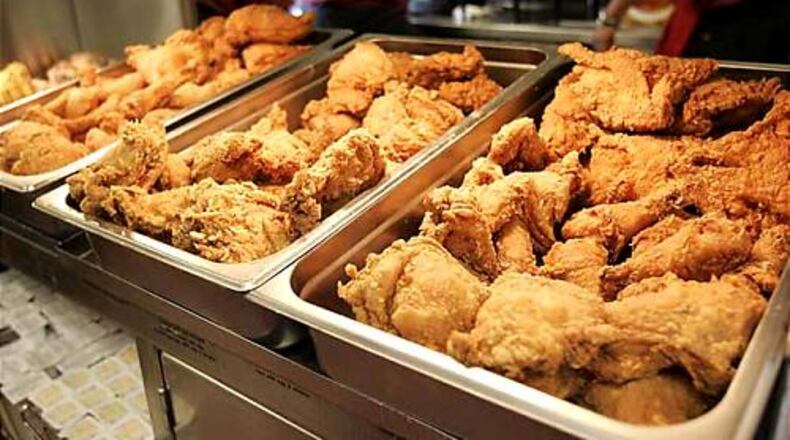 Chicken warms under the hot lights at the Bojangles restaurant on in College Park. The new Bojangles stores are part of a push to open 80 new locations in major Georgia cities.