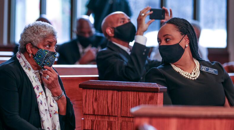 Former Atlanta Mayor Shirley  Franklin, left, speaks with state Sen. Nikema Williams before the funeral for U.S. Rep. John Lewis on July 30 in Atlanta.  Williams was chosen by the state Democratic Party to replace Lewis on the November ballot. (Alyssa Pointer/Atlanta Journal-Constitution/TNS)