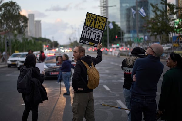 People gather in a protest demanding the immediate release of hostages held by Hamas in the Gaza Strip, during the Jewish holiday of Passover, in Tel Aviv, Israel, Saturday, April 12, 2025. (AP Photo/Leo Correa)