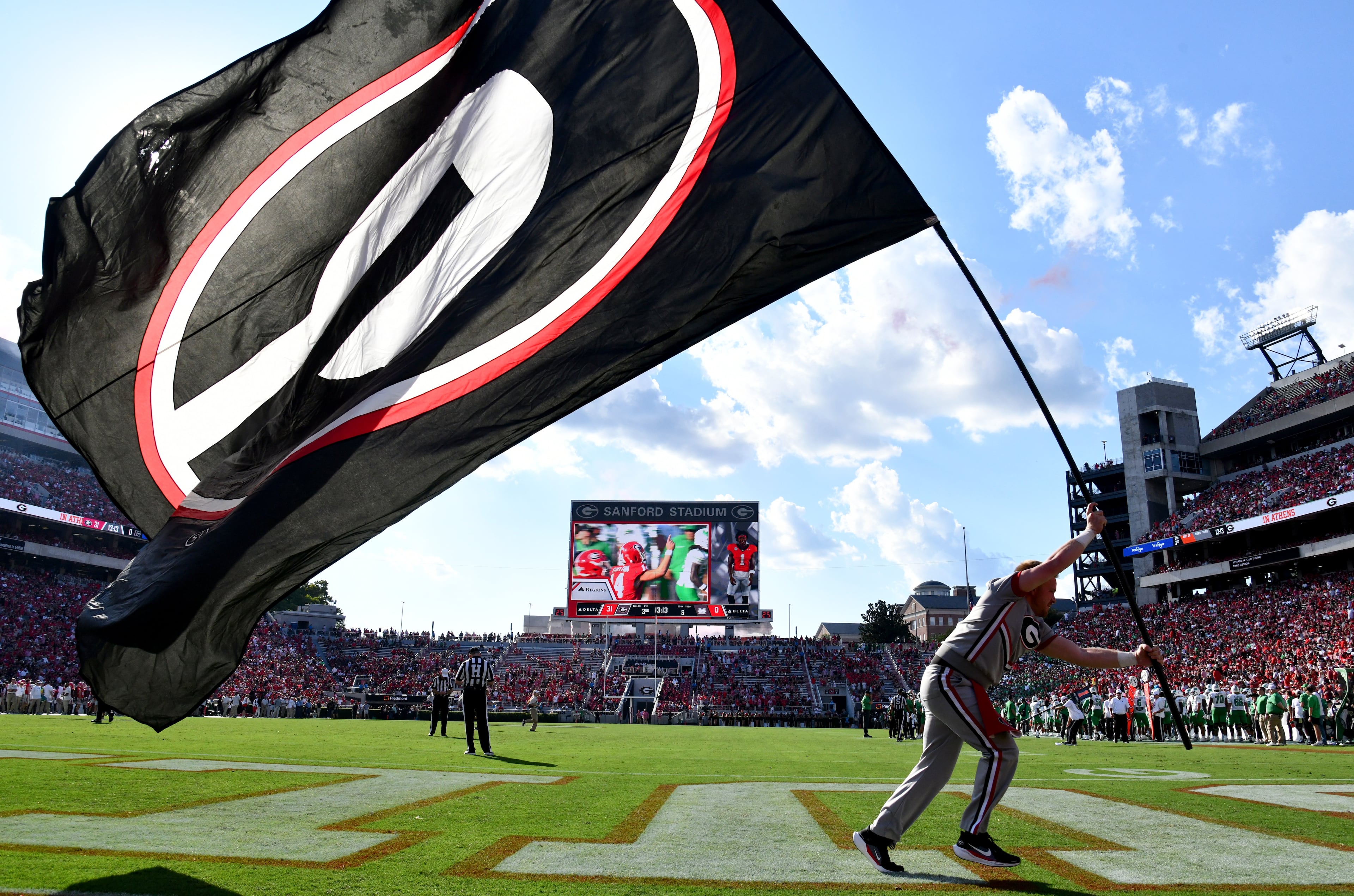 Georgia fans celebrate after wide receiver Zachariah Branch scored a touchdown during the second half in an NCAA football game at Sanford Stadium, Saturday, August 30, 2025, in Athens. Georgia won 45-7 over Marshall. (Hyosub Shin / AJC)