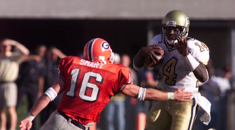 Kirby Smart (16) of Georgia tries to stop Georgia Tech QB Joe Hamilton in 1998. (AJC Staff/KEVIN KEISTER)