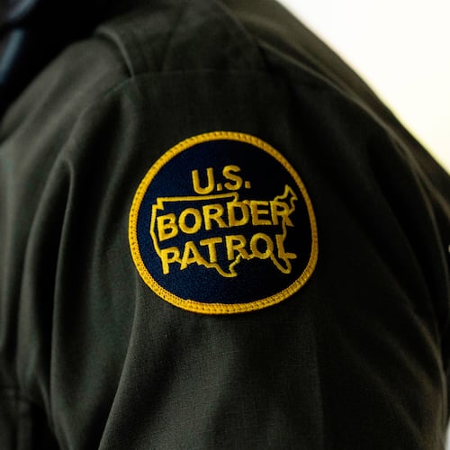 FILE - A U.S Border Patrol badge is displayed as Gregory Bovino, chief patrol agent of the U.S. Border Patrol's El Centro Sector, stands in a conference room before an interview with The Associated Press in Los Angeles, Aug. 25, 2025. (AP Photo/Jae C. Hong, File)