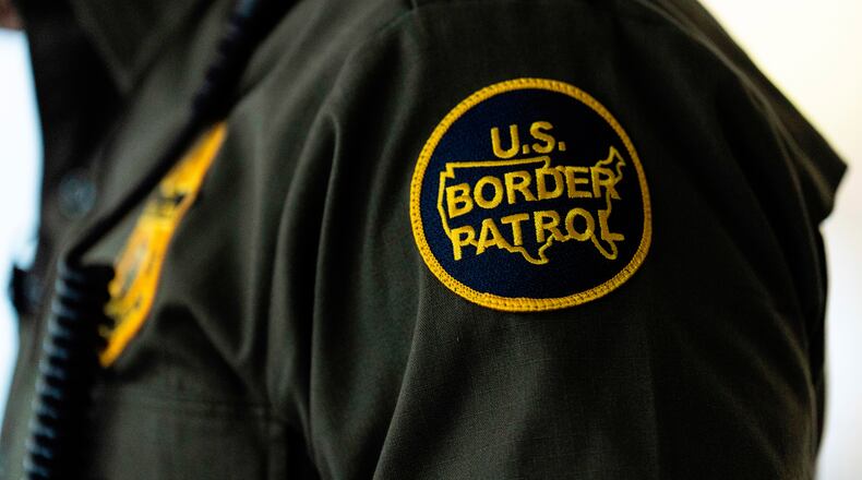 FILE - A U.S Border Patrol badge is displayed as Gregory Bovino, chief patrol agent of the U.S. Border Patrol's El Centro Sector, stands in a conference room before an interview with The Associated Press in Los Angeles, Aug. 25, 2025. (AP Photo/Jae C. Hong, File)