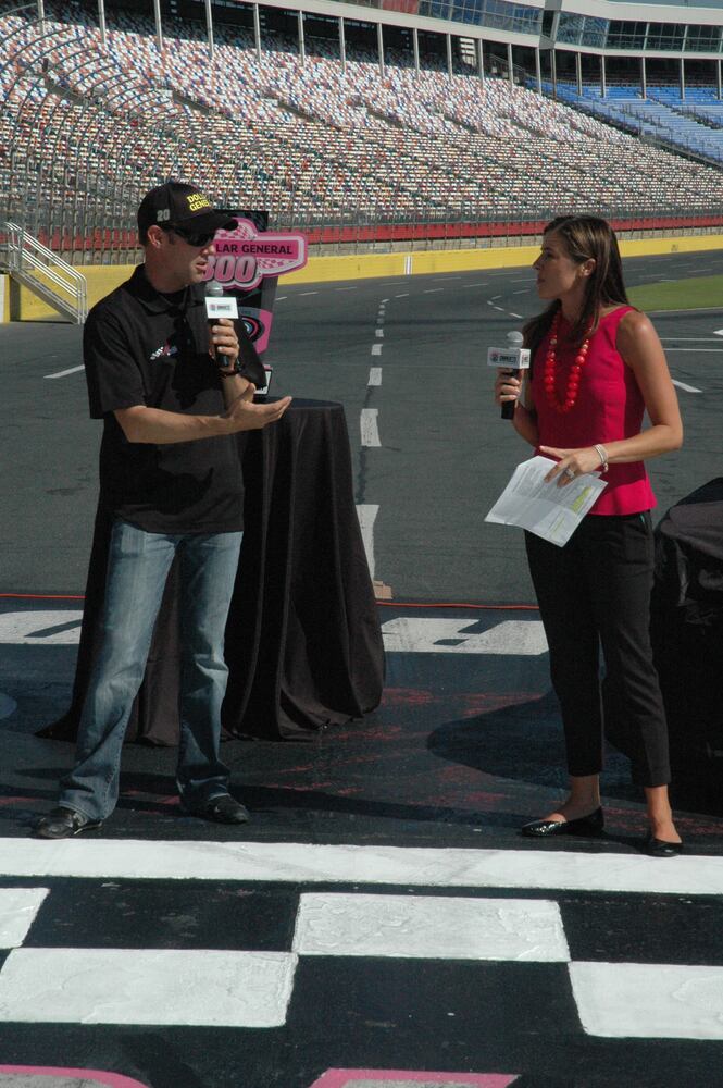 IMAGES: NASCAR drivers, breast cancer survivors paint pit road pink