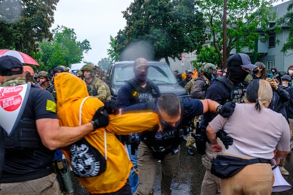 Protesters confront ICE, ATF, and FBI officers as federal agents conduct an operation in Minneapolis, on Tuesday, June 3, 2025. (Kerem Yücel/Minnesota Public Radio via AP)