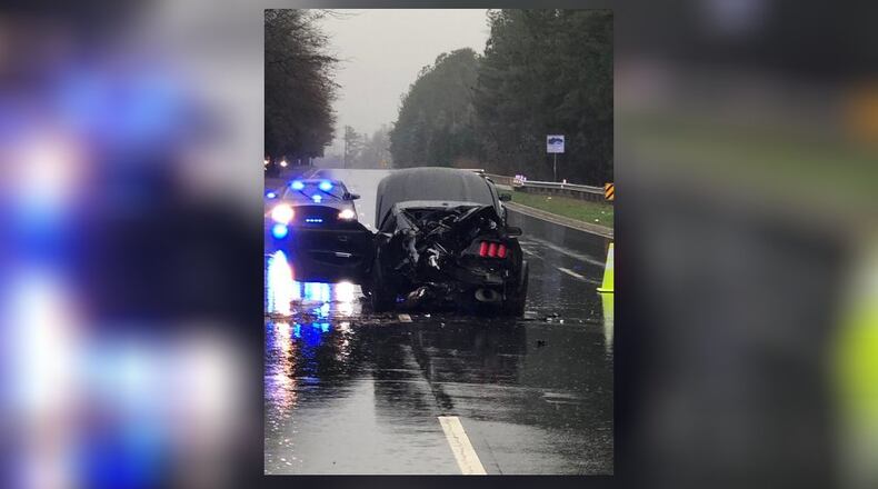 Two men were heading down Barrett Parkway in a black Mustang at a high rate of speed when the the car spun out of control.