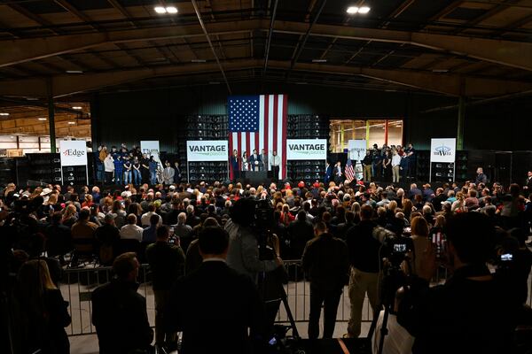 Vice President JD Vance, center stage, speaks at a rally about "America's industrial resurgence," Friday, March 14, 2025, at Vantage Plastics in Bay City, Mich. (AP Photo/Jose Juarez)