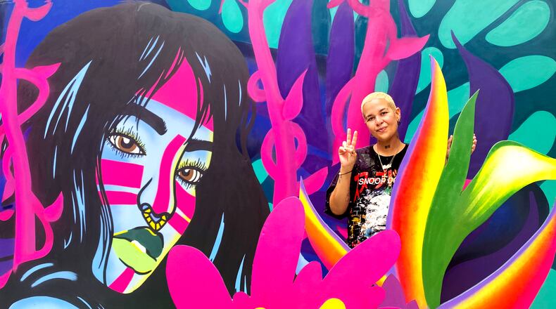 Atlanta-based, Puerto Rican muralist ArrrtAddict, Lisette Correa.