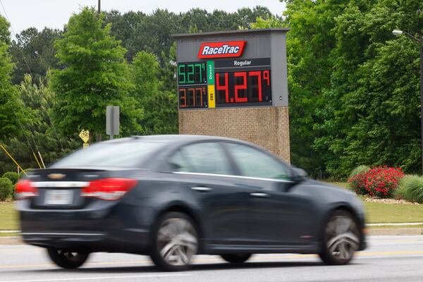 A car passes a RaceTrac gas station in Mableton on May 6, 2026, where prices were well above $4 a gallon. (Arvin Temkar/AJC)