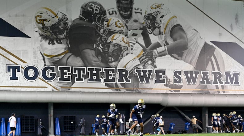 Georgia Tech players run drills during a training camp at Georgia Tech’s indoor practice facility, Tuesday, August 1, 2023, in Atlanta. (Hyosub Shin / Hyosub.Shin@ajc.com)