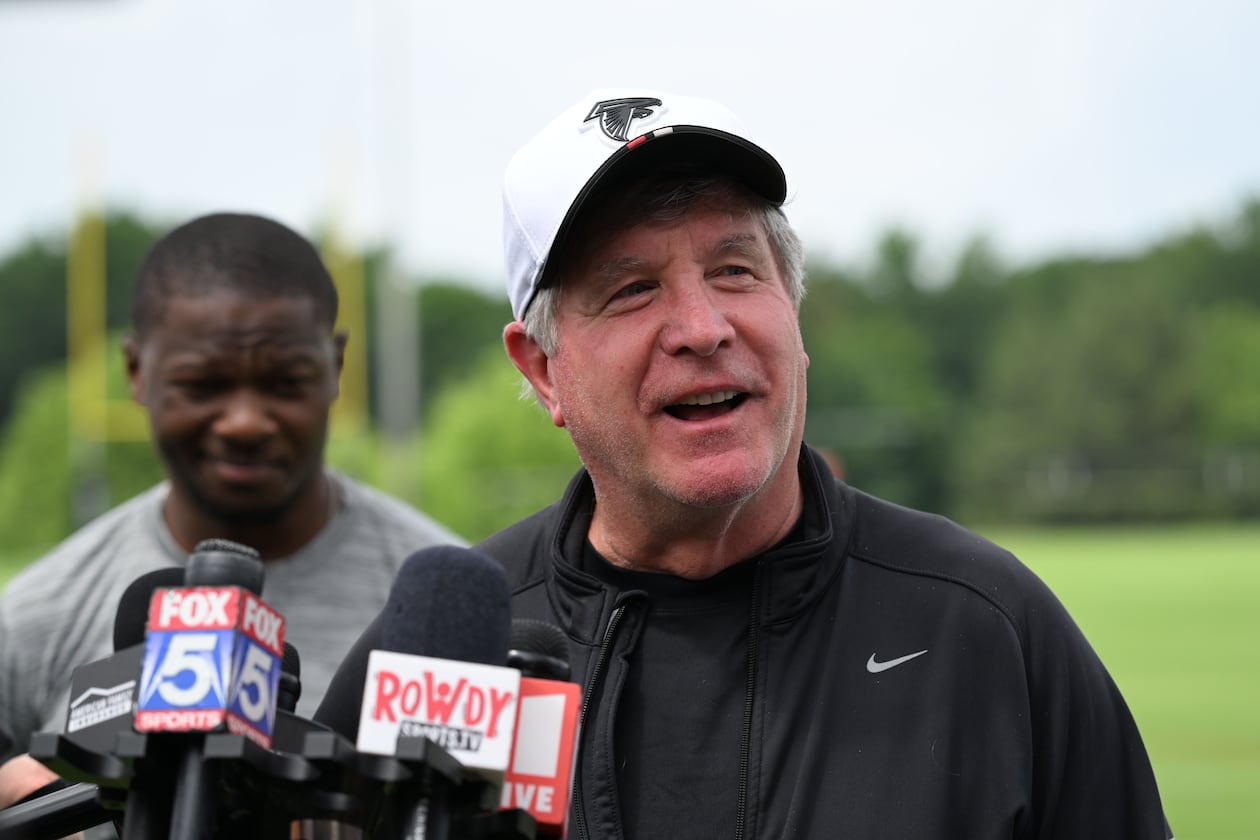 Falcons offensive line coach Bill Callahan, shown speaking to the media at the team's Flowery Branch training facility in May, is dedicated to the details. (Hyosub Shin/AJC)