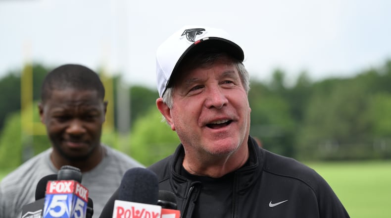 Falcons offensive line coach Bill Callahan, shown speaking to the media at the team's Flowery Branch training facility in May, is dedicated to the details. (Hyosub Shin/AJC)
