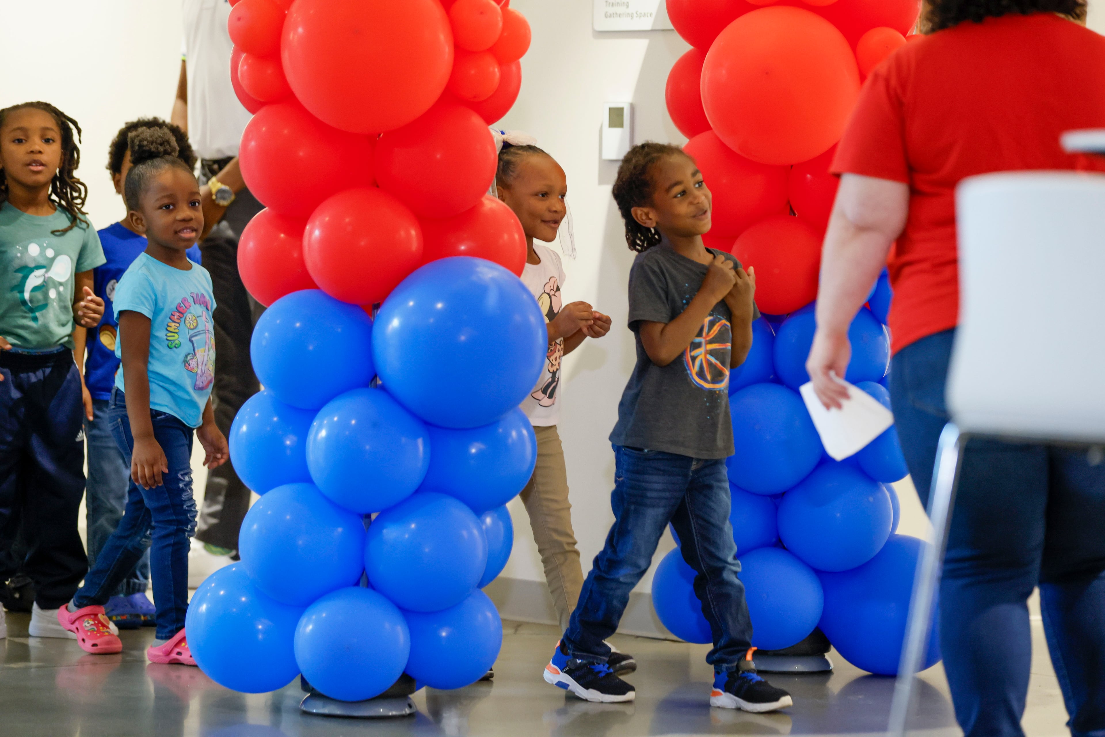 Children in the Head Start program line up as they get ready to sing "Happy Birthday." (Miguel Martinez/AJC)
