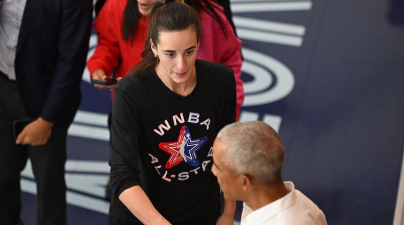 Former President Barack Obama shakes hands with WNBA All-Star Caitlin Clark during a practice at the Obama Presidential Center in Chicago, Friday, July 24, 2026. (AP Photo/Paul Beaty)