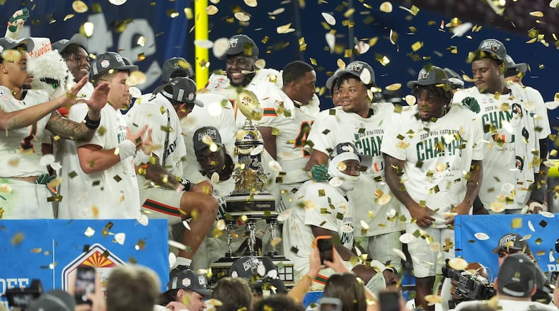 Miami players celebrate after beating Ole Miss — the last SEC team in the College Football Playoff bracket — in the Fiesta Bowl CFP semifinal game on Thursday, Jan. 8, 2026, in Glendale, Ariz. (Ross D. Franklin/AP)
