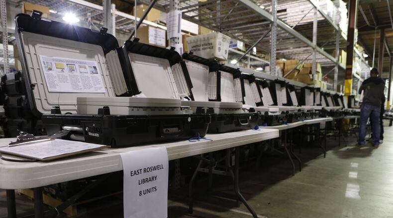 Early voting machines wait to be processed at the Fulton County Elections Preparation Center in Atlanta on November 8th, 2016. (Photo by Phil Skinner)