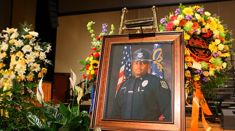 A portrait sits on the stage for the home going service for Griffin police officer Kevin “Shogun” Dorian Jordan, 43, who was murdered outside a Griffin Waffle House on June 9, 2014. CURTIS COMPTON / CCOMPTON@AJC.COM