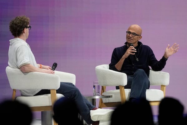Microsoft Chairman and CEO Satya Nadella, right, speaks with Meta Founder and CEO Mark Zuckerberg at LlamaCon 2025, an AI developer conference, in Menlo Park, Calif., Tuesday, April 29, 2025. (AP Photo/Jeff Chiu)