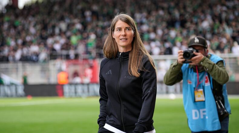 New head coach of German Bundesliga soccer club 1. FC Union Berlin Marie-Louise Eta looks on during the warm up prior to the German Bundesliga soccer match between FC Union Berlin and Wolfsburg in Berlin, Germany, Saturday, April 18, 2026. (AP Photo/Ebrahim Noroozi)