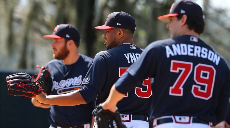 Braves pitchers Thomas Burrows (from left), Huascar Ynoa, and Ian Anderson get some work in the bullpen Sunday, Feb. 17, 2019, at the ESPN Wide World of Sports Complex in Lake Buena Vista, Fla.