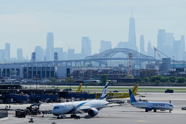 FILE - The New York City skyline is seen behind Newark Liberty International Airport in Newark, N.J., Wednesday, May 7, 2025. (AP Photo/Seth Wenig)