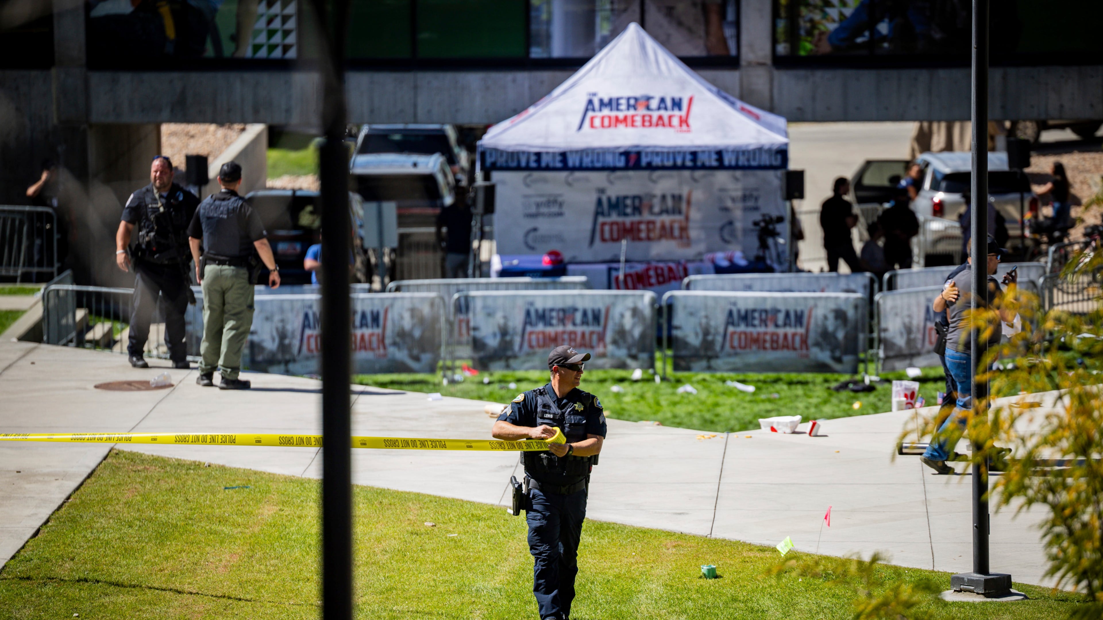 CORRECTS PHOTOGRAPHER LAST NAME FROM CROEWLEY TO CROWLEY - Law enforcement tapes off an area after Charlie Kirk, the CEO and co-founder of the conservative youth organization Turning Point USA, was shot at Utah Valley University, Wednesday, Sept. 10, 2025, in Orem, Utah. (Tess Crowley/The Deseret News via AP)