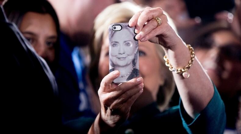 A photograph of Democratic presidential candidate Hillary Clinton is displayed on a smartphone as she takes a selfie with a supporter after speaking at a rally at the Culinary Academy of Las Vegas in Las Vegas, Tuesday, July 19, 2016. (AP Photo/Andrew Harnik)