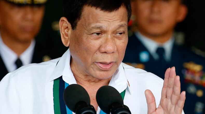FILE - Philippine President Rodrigo Duterte addresses the troops during the 82nd anniversary celebration of the Armed Forces of the Philippines in suburban Quezon city northeast of Manila, Philippines on Dec. 20, 2017. (AP Photo/Bullit Marquez, File)