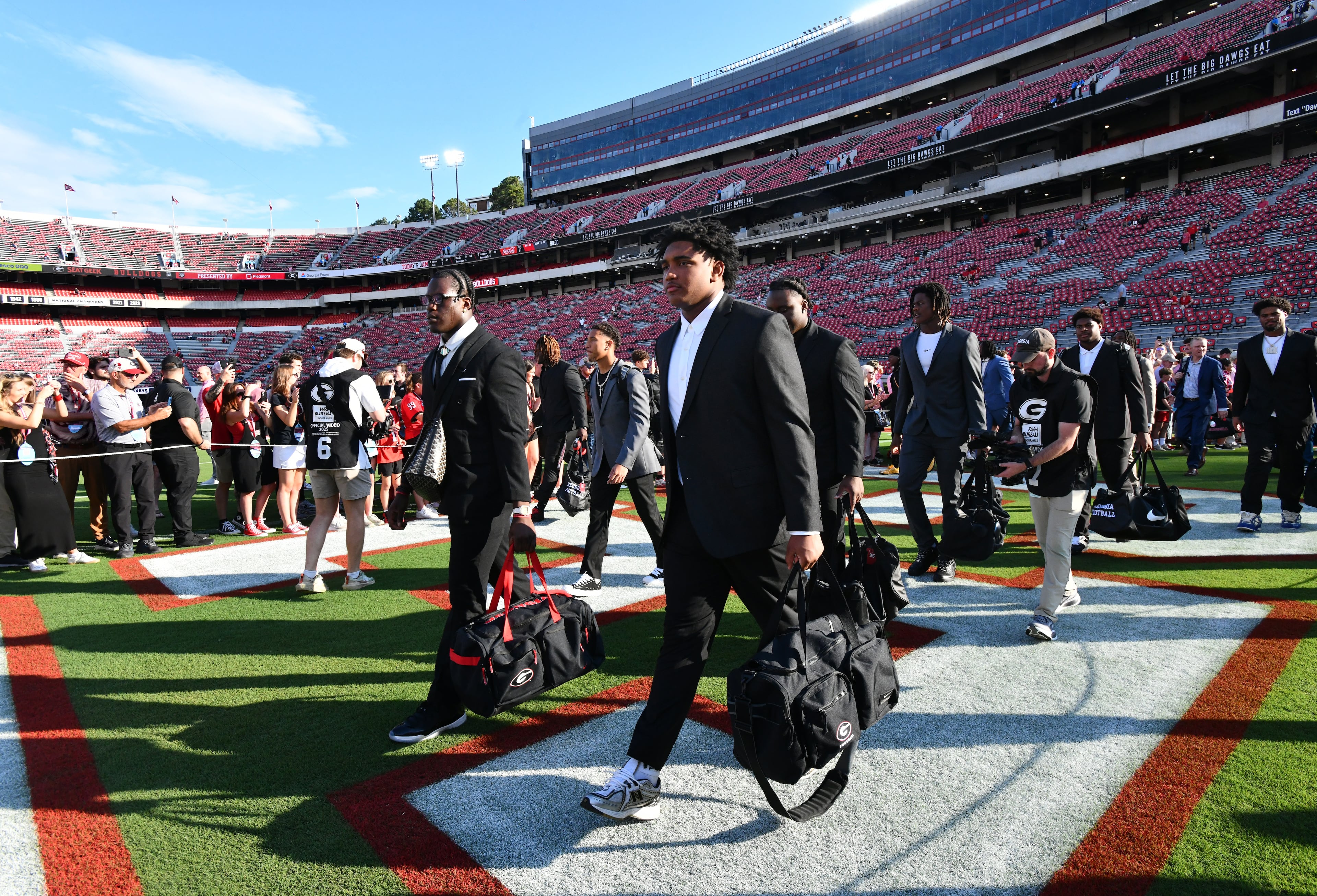 Georgia players and coaching staff arrive during the Dawg Walk to play Alabama in a NCAA college football game at Sanford Stadium, Saturday, September 27, 2025, in Athens. (Hyosub Shin / AJC)