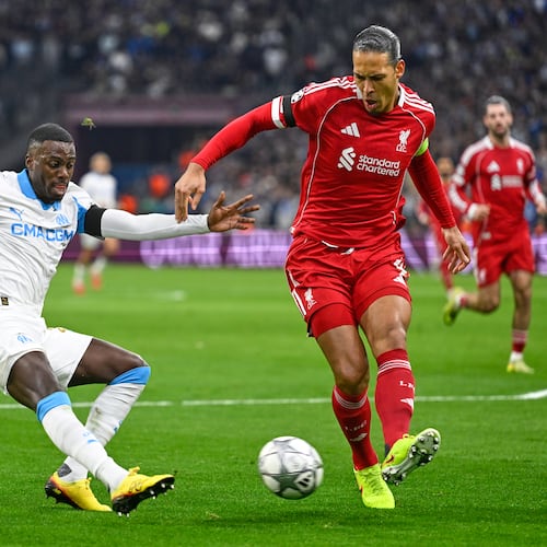 Liverpool's Virgil van Dijk kicks the ball ahead of Marseille's Timothy Weah, left, during the Champions League opening phase soccer match between Marseille and Liverpool in Marseille, France, Wednesday, Jan. 21, 2026. (AP Photo/Philippe Magoni)