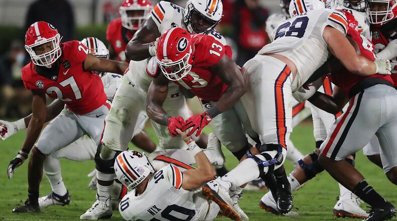 Georgia linebacker Azeez Ojulari sacks Auburn quarterback Bo Nix for a loss Saturday, Oct 3, 2020 in Athens. Georgia beat Auburn 27-6.   “Curtis Compton / Curtis.Compton@ajc.com”