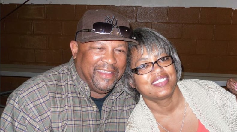 This August 2011 photo provided by Qureshi Law shows Erie Moore, Sr. with his sister, Catherine Moore, at his grandson's birthday in Bastrop, La. (Qureshi Law via AP)