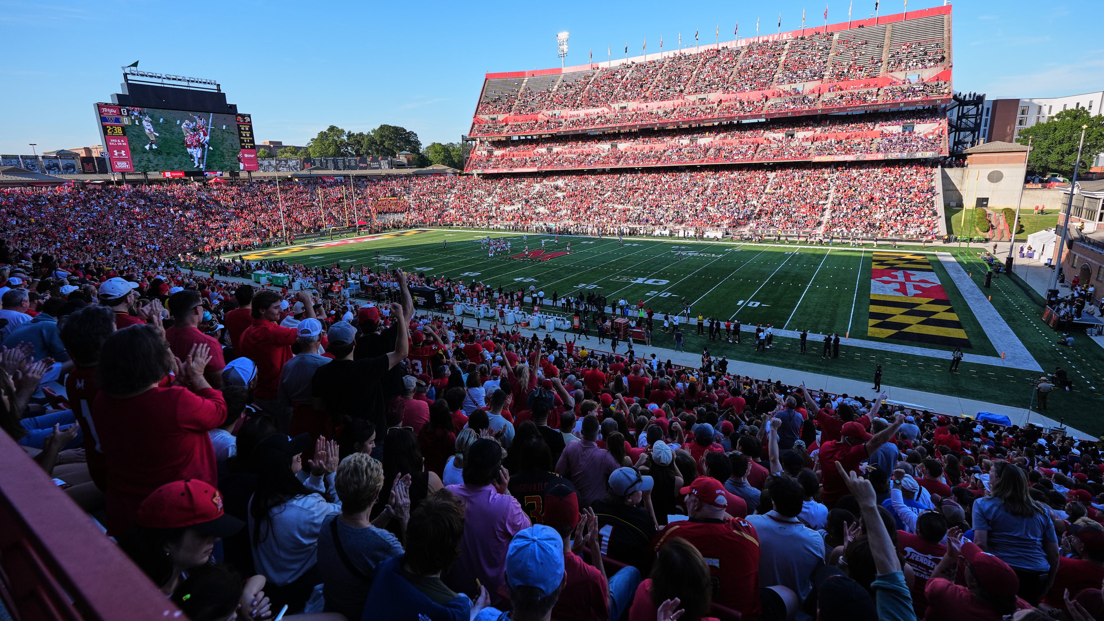 Fans cheer during the first half of an NCAA college football game between Maryland and Washington, Saturday, Oct. 4, 2025, in College Park, Md. (AP Photo/Stephanie Scarbrough)