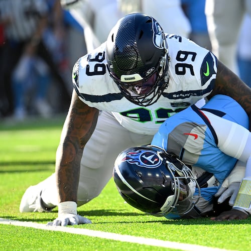Seattle Seahawks defensive end Leonard Williams (99) sacks Tennessee Titans quarterback Cam Ward during the second half of an NFL football game Sunday, Nov. 23, 2025, in Nashville, Tenn. (John Amis/AP)