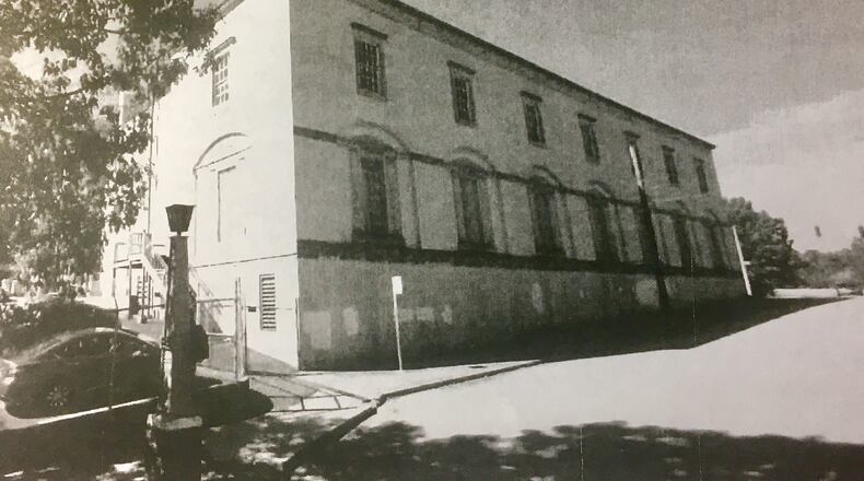 Though in black and white, this is a fairly recent look at the now abandoned AT&T building at Decatur’s Park Place and East Lake Drive (running alongside the building). Thrive Homes wants to redevelop the structure, a plan that was at least temporarily stalled by legal issues raised during a Monday commission meeting. Courtesy of Thrive Homes.