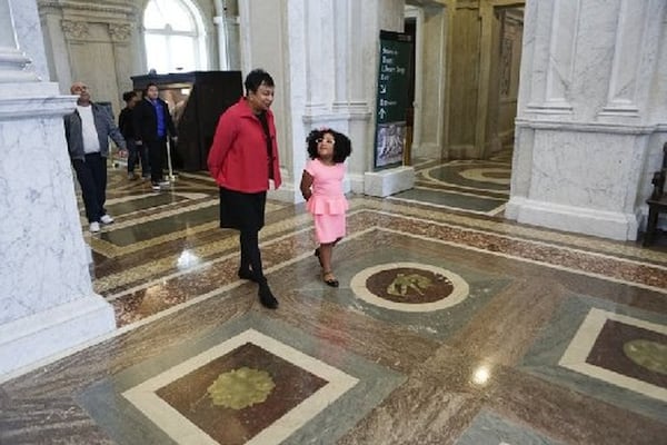 Daliyah Marie Arana of Gainesville walks with the 14th Librarian of Congress, Carla Hayden, at the Library of Congress in Washington, D.C., in January. CONTRIBUTED BY CARLA HAYDEN / LIBRARY OF CONGRESS