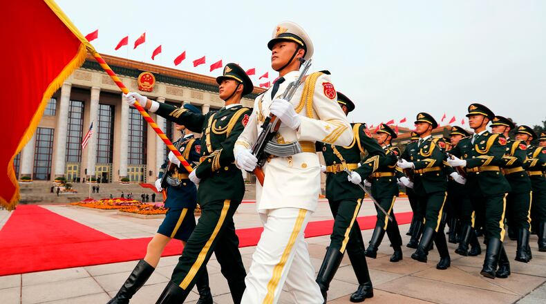 FILE - Members of an honor guard march as they prepare for a welcome ceremony for visiting U.S. President Donald Trump outside the Great Hall of the People in Beijing, Nov. 9, 2017. (AP Photo/Andy Wong, File)