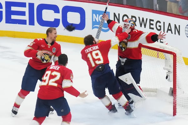 Florida Panthers goalie Sergei Bobrovsky (72), Matthew Tkachuk (19), Gustav Forsling (42) and Tomas Nosek (92) celebrate after defeating the Edmonton Oilers in Game 6 of the Stanley Cup final in Sunrise, Fla., Tuesday, June 17, 2025. (Nathan Denette/The Canadian Press via AP)