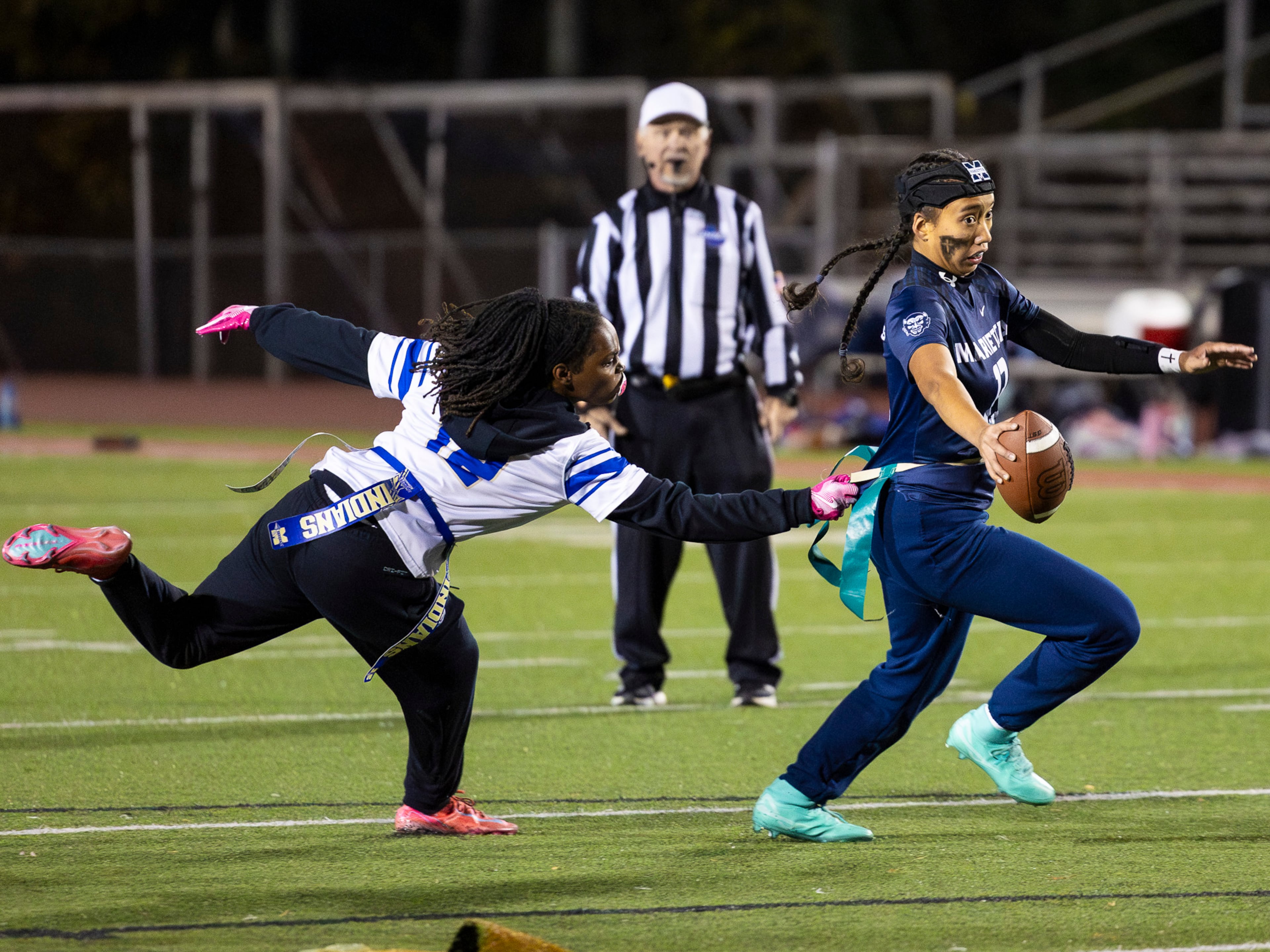 Marietta's Kaylee Wang (13) gets her flag pulled in a flag football game against McEachern at Osborne High School in Marietta, GA on Monday, November 17th, 2025. (Oscar Guevara Saenz for the AJC)