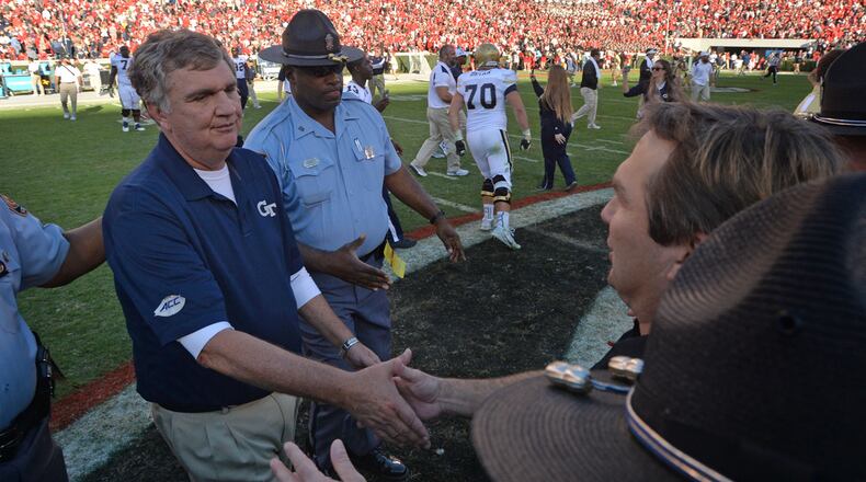 Paul Johnson and Kirby Smart shake hands after Georgia Tech’s 28-27 victory  at Sanford Stadium on Saturday, Nov. 26, 2016.