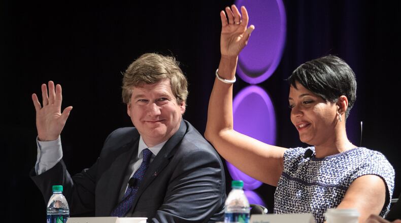 Atlanta mayoral candidates Peter Aman (L) and Keisha Lance Bottoms answer questions at a forum. STEVE SCHAEFER / SPECIAL TO THE AJC