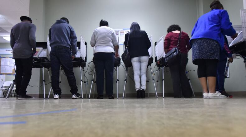 Gwinnett County residents cast their votes on Nov. 8, 2016, at Amazing Grace Lutheran Church in Lawrenceville. HYOSUB SHIN / HSHIN@AJC.COM File Photo
