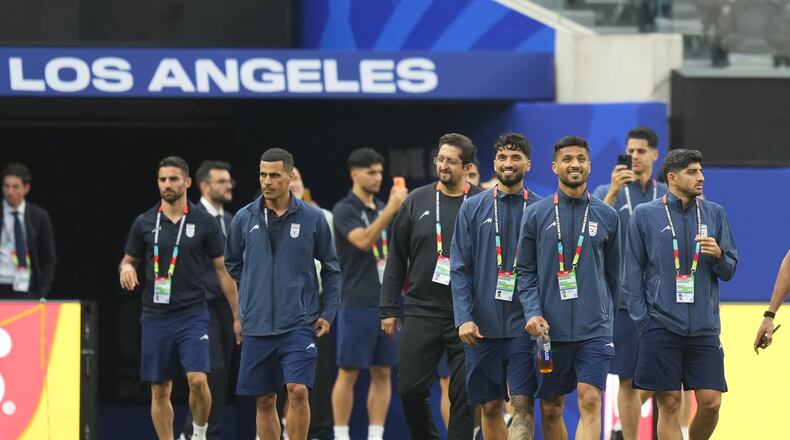 Iran players walk onto the pitch at the stadium one day before their FIFA World Cup match against New Zealand in Inglewood, Calif., near Los Angeles, Sunday, June 14, 2026. (AP Photo/Andre Penner)