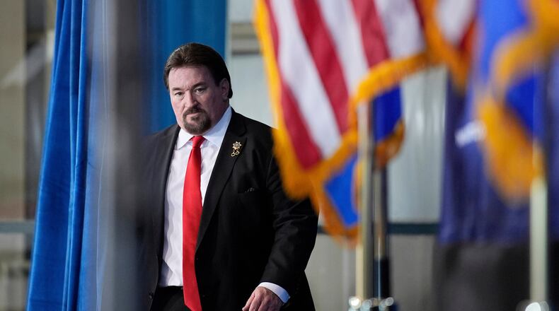 FILE - Nevada GOP chair Michael McDonald walks on stage before speaking ahead of Republican presidential candidate former President Donald Trump at a campaign event, Jan. 27, 2024, in Las Vegas. (AP Photo/John Locher, File)