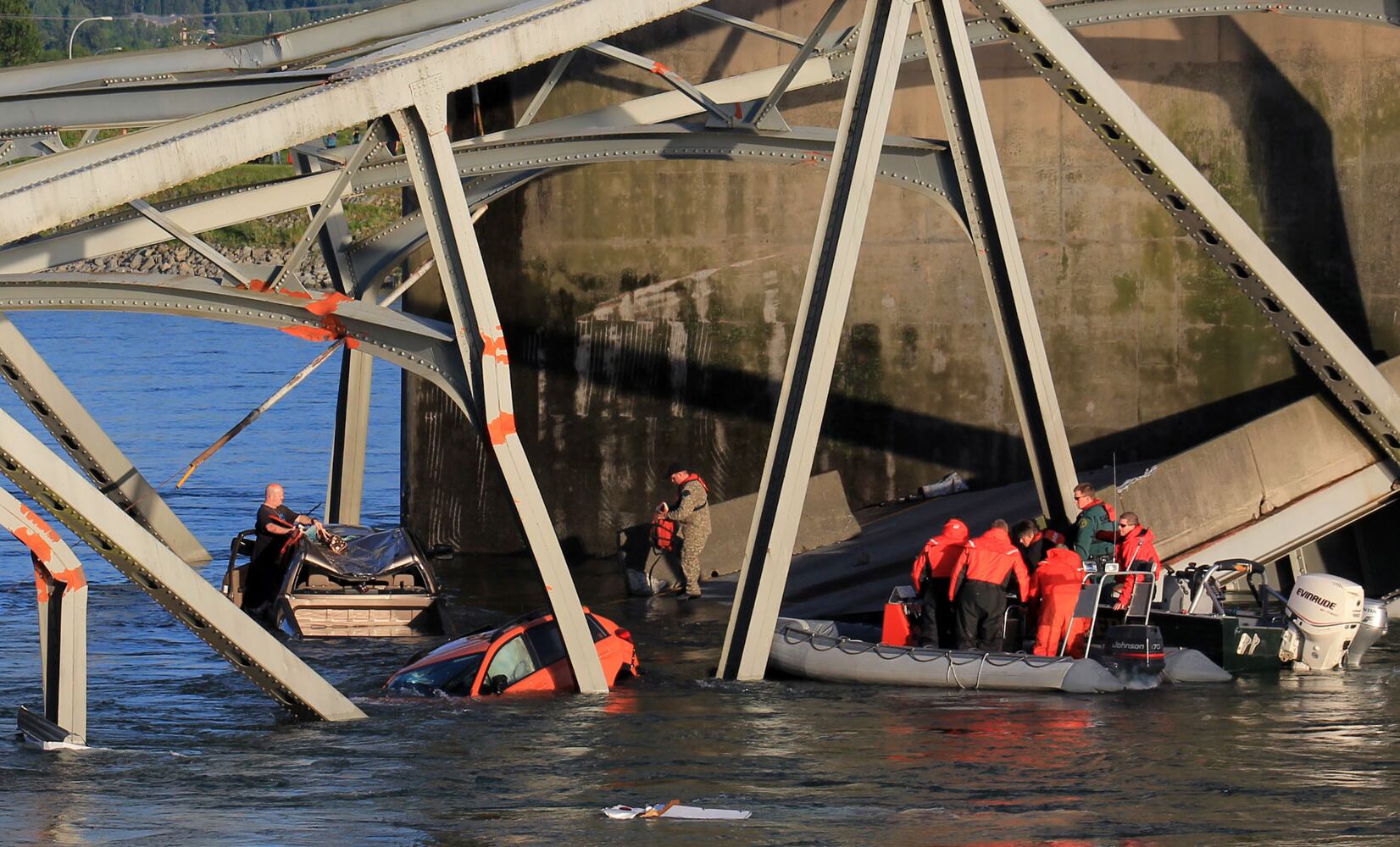 Vehicles, people dumped into water